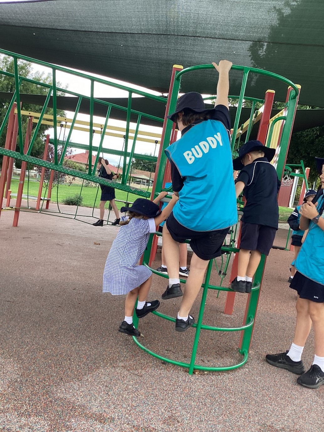 Buddy playing with Foundation student on the playground.
